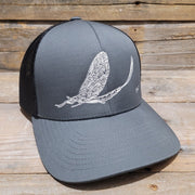 White Mayfly embroidered fly fishing structured trucker hat in Graphite color.- High on the fly Hats